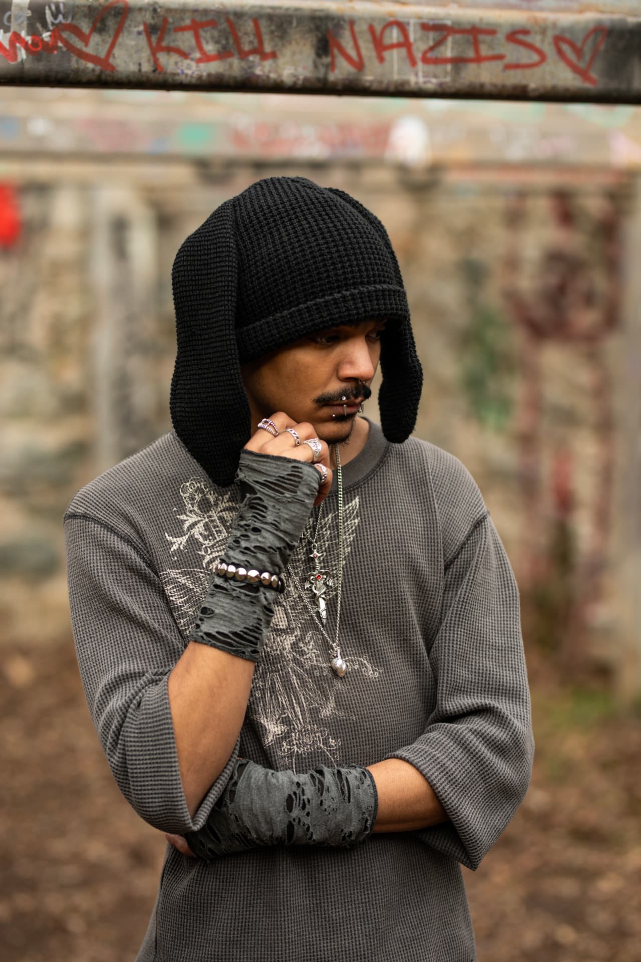 Streetwear editorial in front of graffiti wall